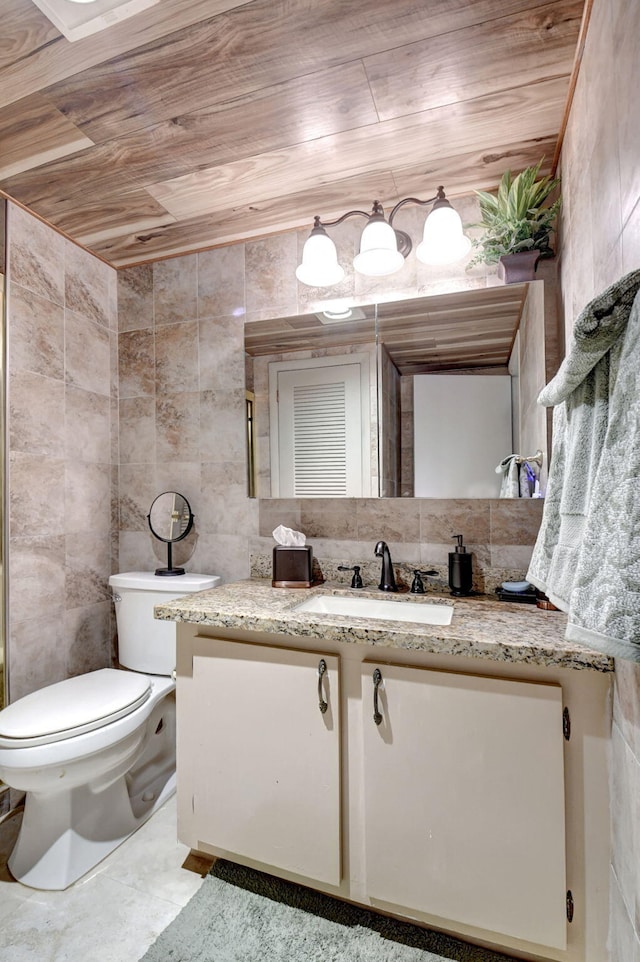 bathroom with toilet, vanity, tile walls, and wooden ceiling