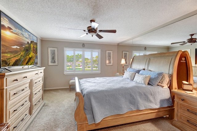 carpeted bedroom with ceiling fan and a textured ceiling