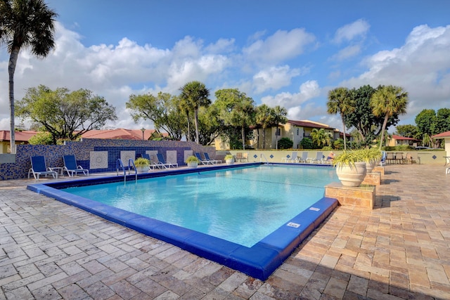 view of swimming pool with a patio area