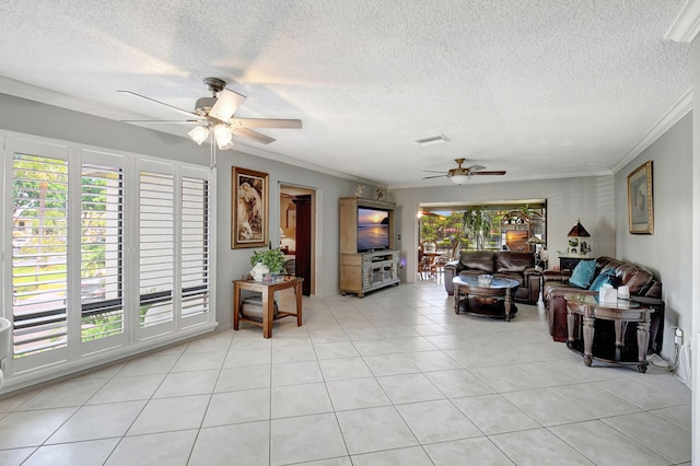 tiled living room with ceiling fan, a wealth of natural light, and crown molding