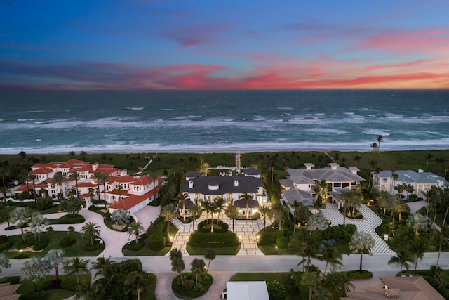 aerial view at dusk with a water view