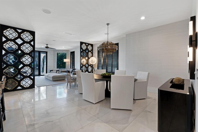 dining room with ceiling fan with notable chandelier