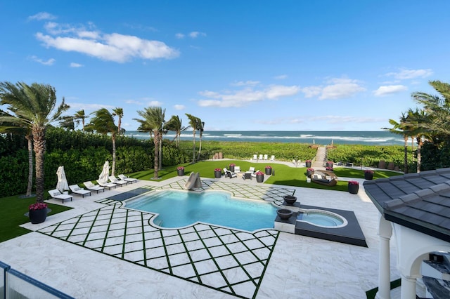 view of swimming pool with a lawn, an in ground hot tub, a patio, and a water view