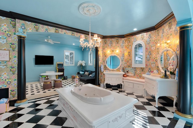 bathroom featuring crown molding, vanity, a bathing tub, and decorative columns