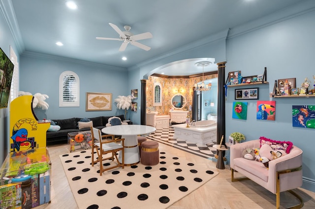 playroom featuring light parquet floors, crown molding, and ceiling fan