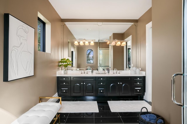 bathroom featuring vanity and an enclosed shower