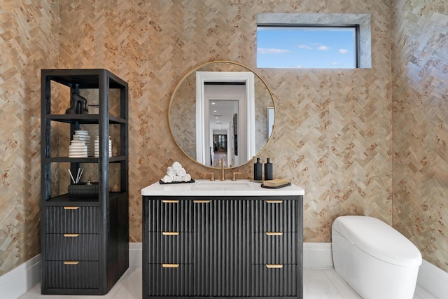 bathroom featuring tile patterned floors, vanity, and toilet