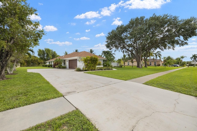 ranch-style house featuring a front yard and a garage