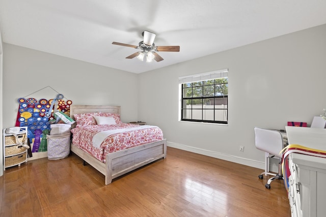 bedroom featuring hardwood / wood-style flooring and ceiling fan