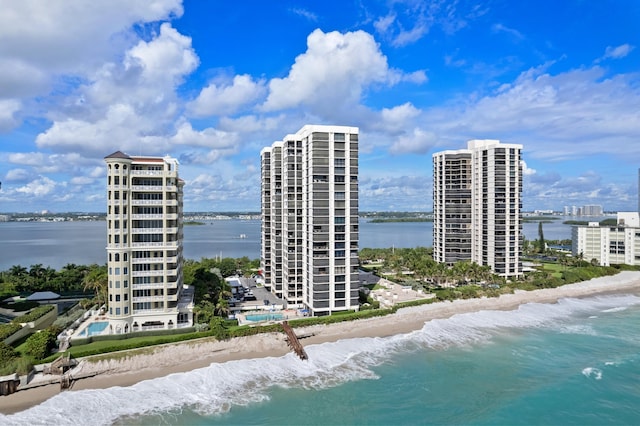 birds eye view of property with a view of the beach and a water view