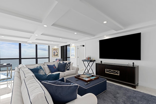 living room featuring beamed ceiling, a water view, and coffered ceiling