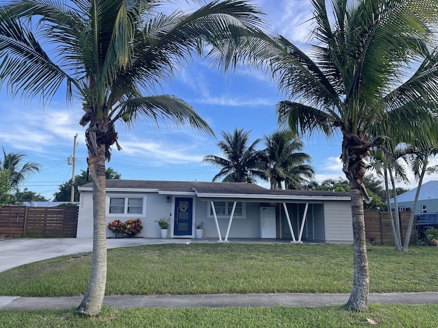 ranch-style home with a front yard