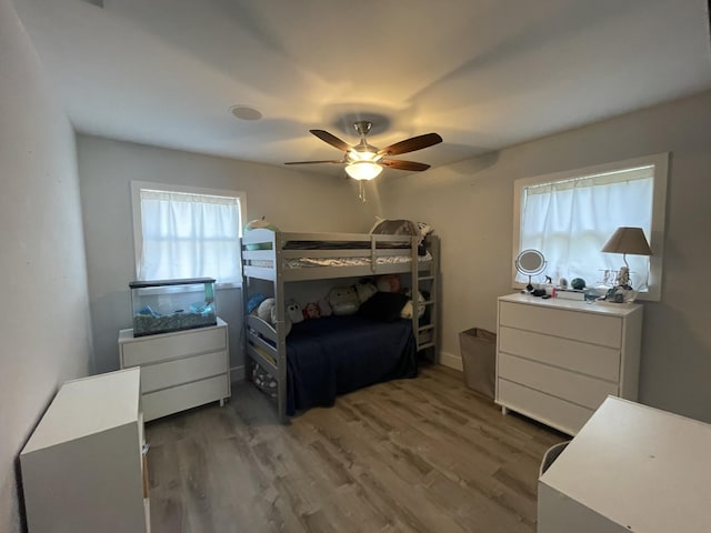 bedroom featuring dark wood-type flooring and ceiling fan