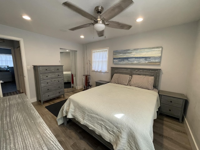 bedroom featuring ceiling fan and dark hardwood / wood-style flooring