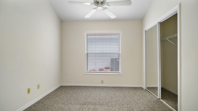 unfurnished bedroom with ceiling fan, carpet flooring, and a closet