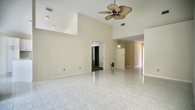 spare room with high vaulted ceiling and ceiling fan