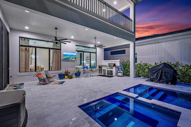 view of swimming pool featuring an in ground hot tub and ceiling fan