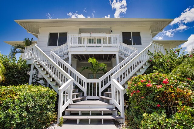 13064 Via Flavia, Placida, FL 33946 - view of front of house with stairway and a deck