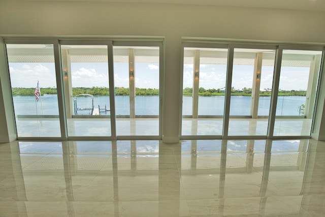 details with tile patterned floors and a water view