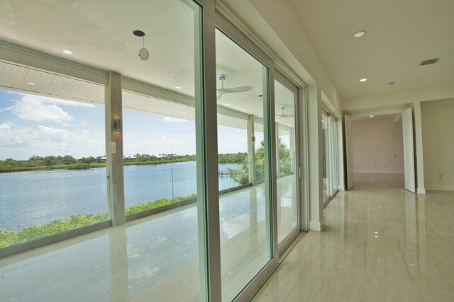 13064 Via Flavia, Placida, FL 33946 - unfurnished sunroom featuring a water view and healthy amount of natural light