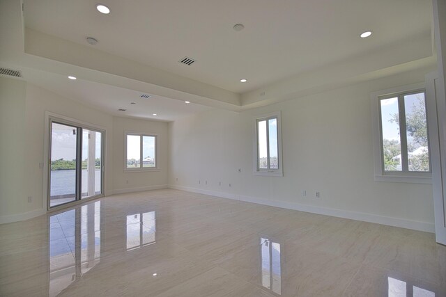 13064 Via Flavia, Placida, FL 33946 - unfurnished room featuring recessed lighting, baseboards, a tray ceiling, and a smoke detector