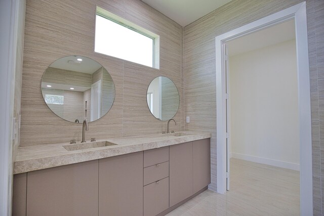 13064 Via Flavia, Placida, FL 33946 - bathroom with double vanity and baseboards