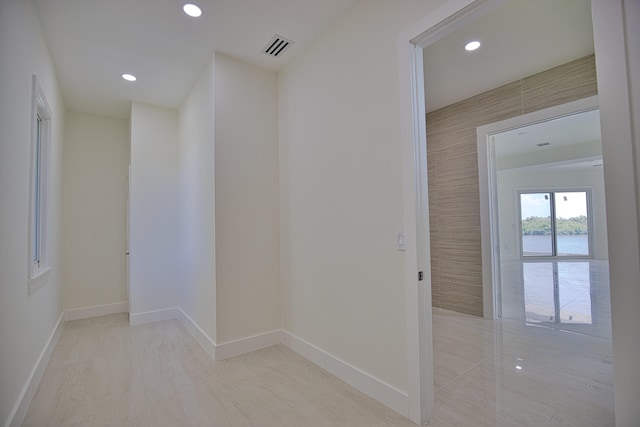 hallway featuring light tile patterned floors