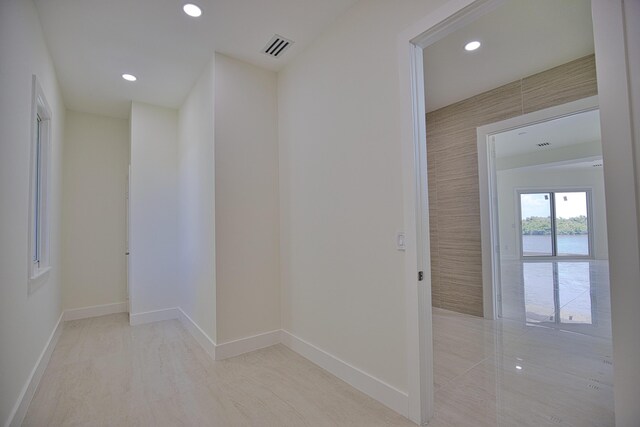 13064 Via Flavia, Placida, FL 33946 - corridor with recessed lighting, baseboards, and a water view