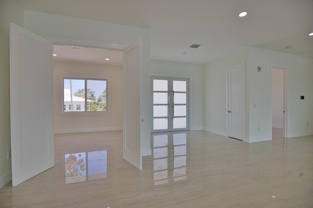 13064 Via Flavia, Placida, FL 33946 - unfurnished room with healthy amount of natural light, french doors, recessed lighting, and baseboards