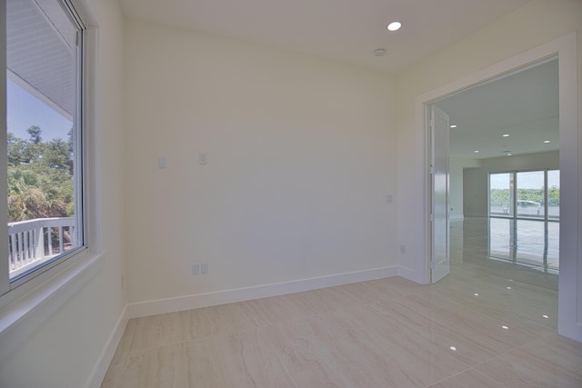 13064 Via Flavia, Placida, FL 33946 - empty room with recessed lighting and baseboards
