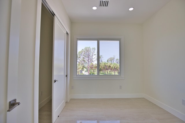 unfurnished bedroom with light hardwood / wood-style floors and a closet