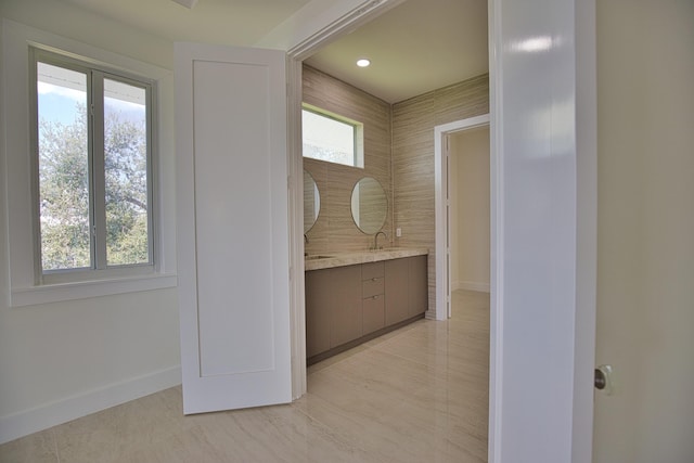 13064 Via Flavia, Placida, FL 33946 - hall with baseboards, light tile patterned floors, and a sink