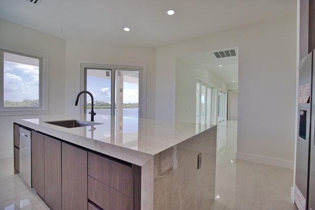 13064 Via Flavia, Placida, FL 33946 - kitchen featuring modern cabinets, a sink, a large island with sink, plenty of natural light, and recessed lighting