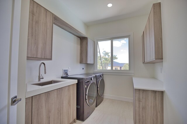 13064 Via Flavia, Placida, FL 33946 - laundry area with cabinet space, washing machine and clothes dryer, baseboards, and recessed lighting