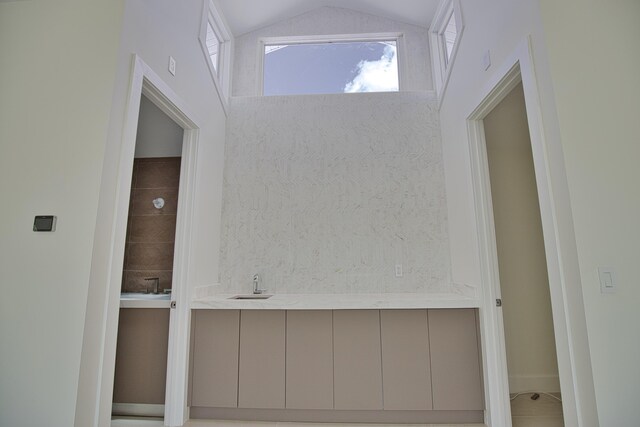 13064 Via Flavia, Placida, FL 33946 - bathroom with a sink and lofted ceiling