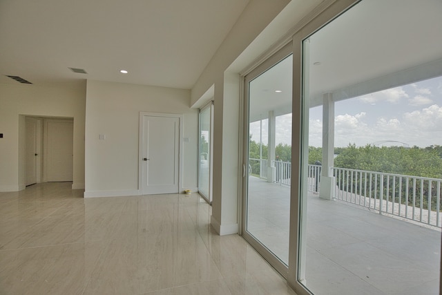 hallway featuring light tile patterned floors