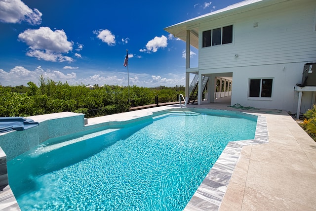 view of swimming pool featuring a patio area