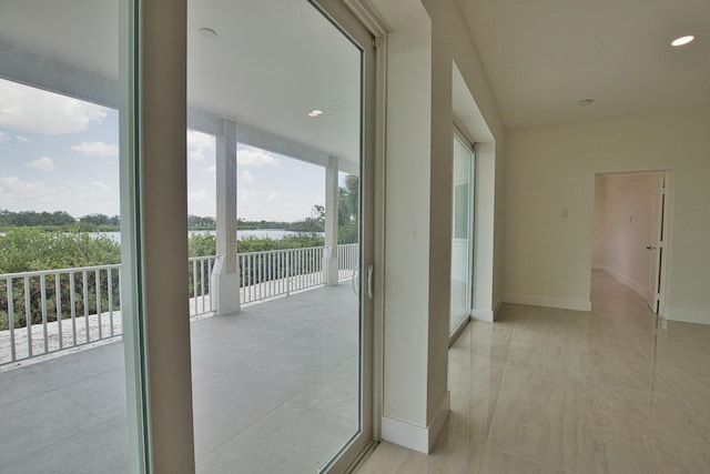 hallway with light tile patterned floors