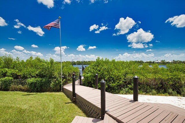 13064 Via Flavia, Placida, FL 33946 - dock featuring a lawn and a water view