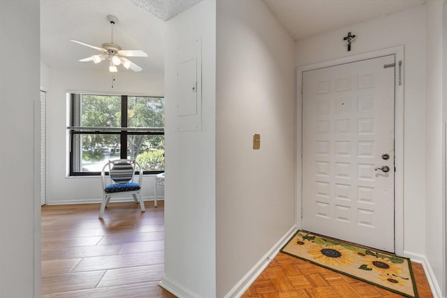 entrance foyer with ceiling fan