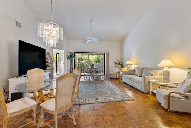 dining area with a notable chandelier, high vaulted ceiling, and light parquet floors