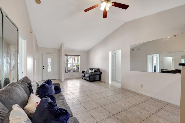 tiled living room with ceiling fan and vaulted ceiling