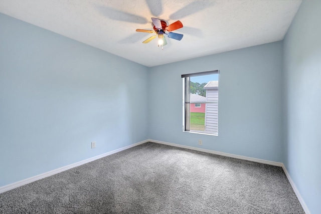 unfurnished room featuring ceiling fan and carpet