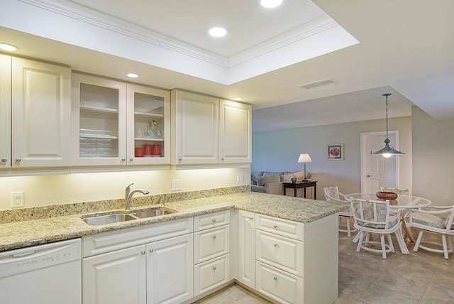 kitchen featuring sink, kitchen peninsula, white dishwasher, decorative light fixtures, and ornamental molding