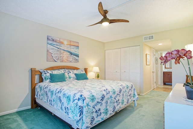 bedroom with ceiling fan and carpet