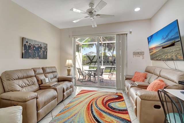 living area featuring light tile patterned floors, a ceiling fan, and recessed lighting