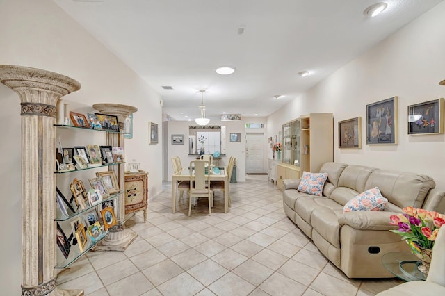 living room featuring light tile patterned floors and visible vents