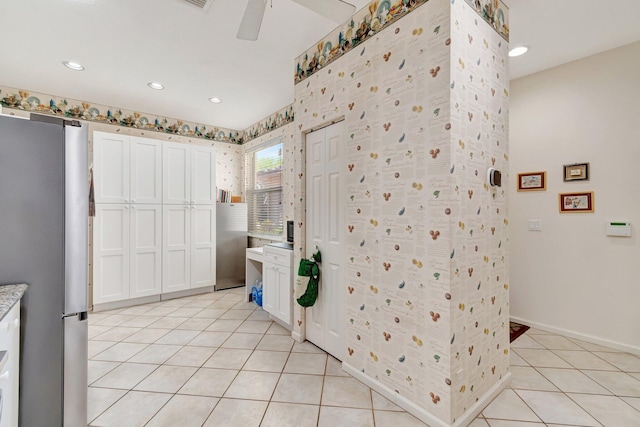 interior space with vanity, a ceiling fan, baseboards, recessed lighting, and tile patterned flooring