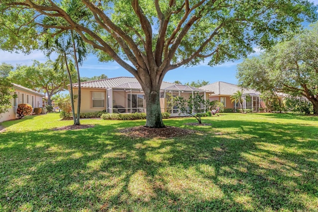 view of yard featuring a lanai