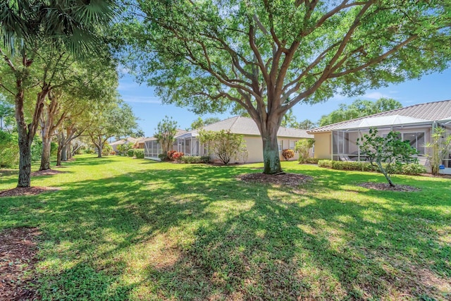 view of yard featuring a lanai